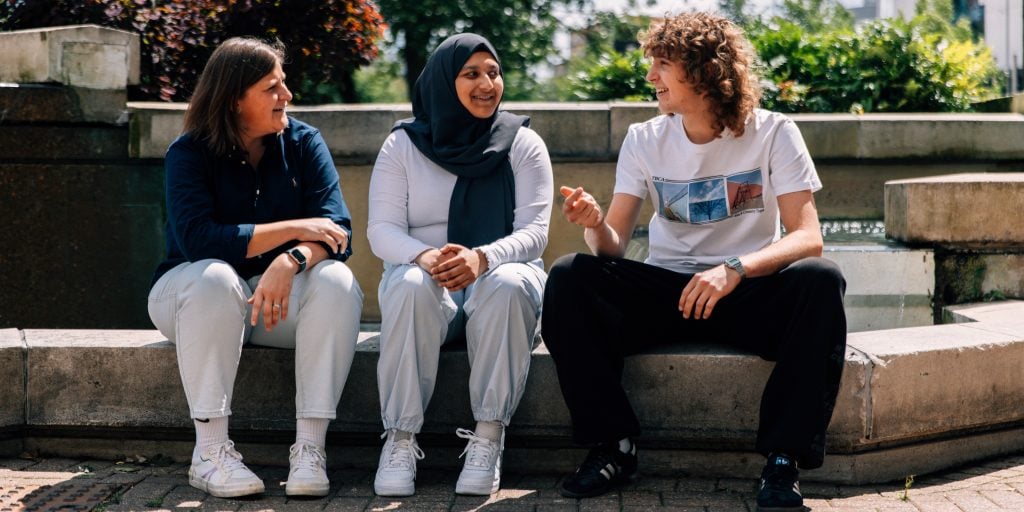 A group of apprentices in discussion
