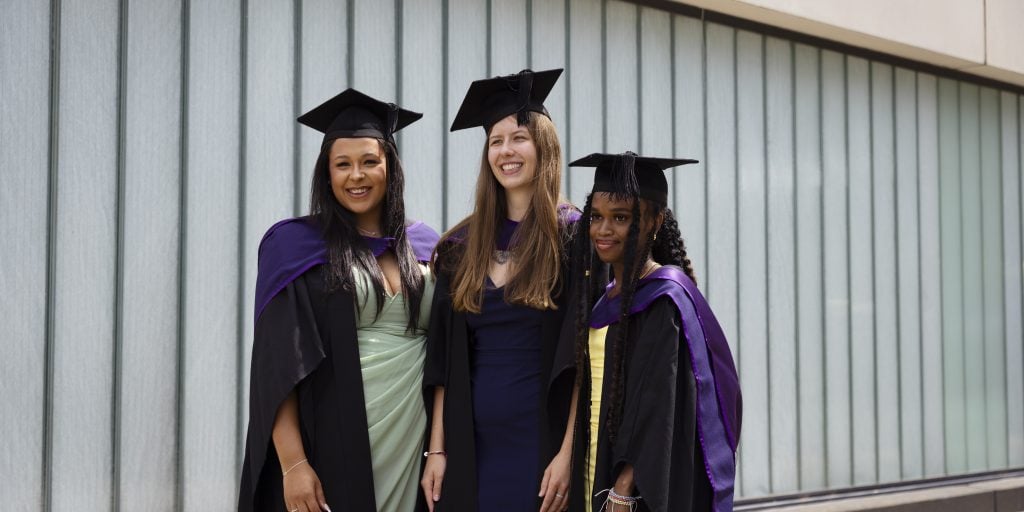 Some graduates posing for a picture