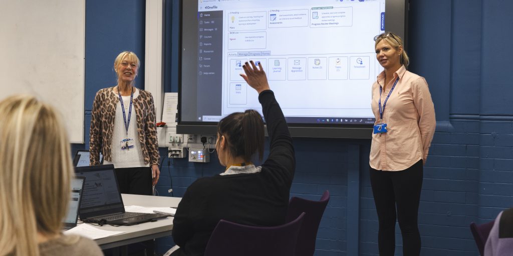 A person with their hand up