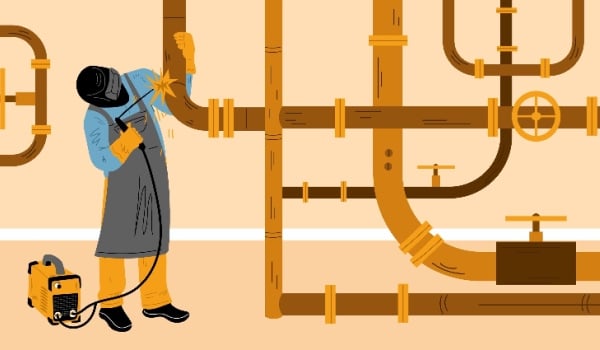 Welder worker welding pipeline with pipes and steel constructions